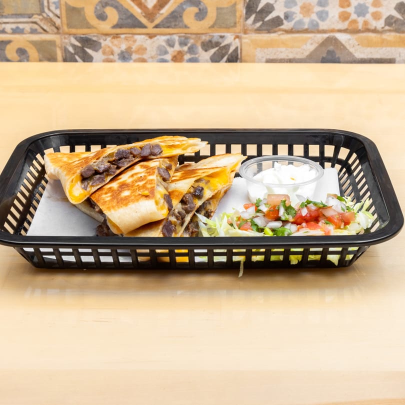 Four quesadilla wedges with meat and cheese, served with sour cream and pico de gallo.